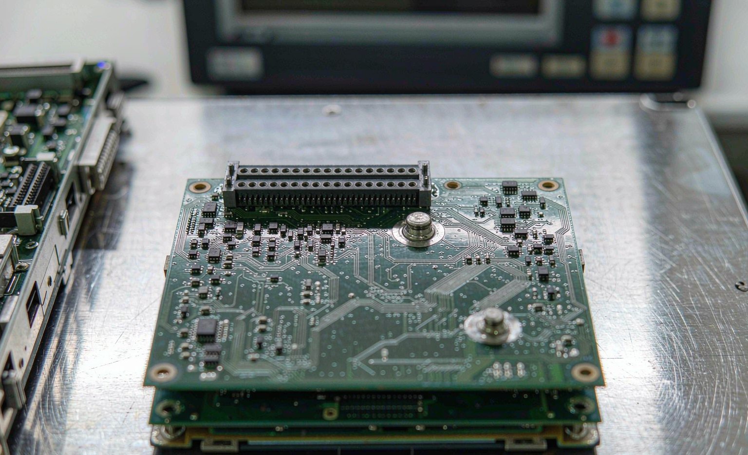 Automotive ECU printed circuit board with connectors during incoming inspection